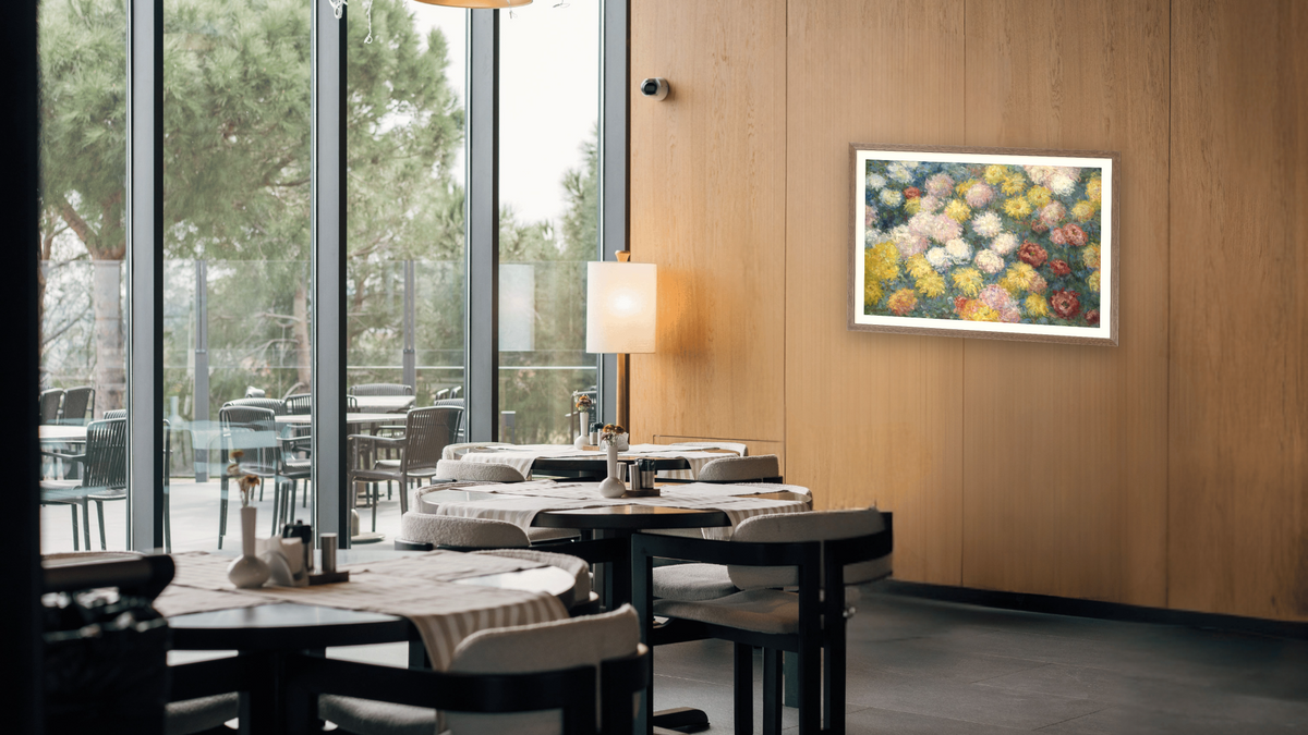 Chrysanthemums by Claude Monet, shown at 28 × 42 in (71.1 × 106.7 cm) in Arber Light Walnut, restaurant