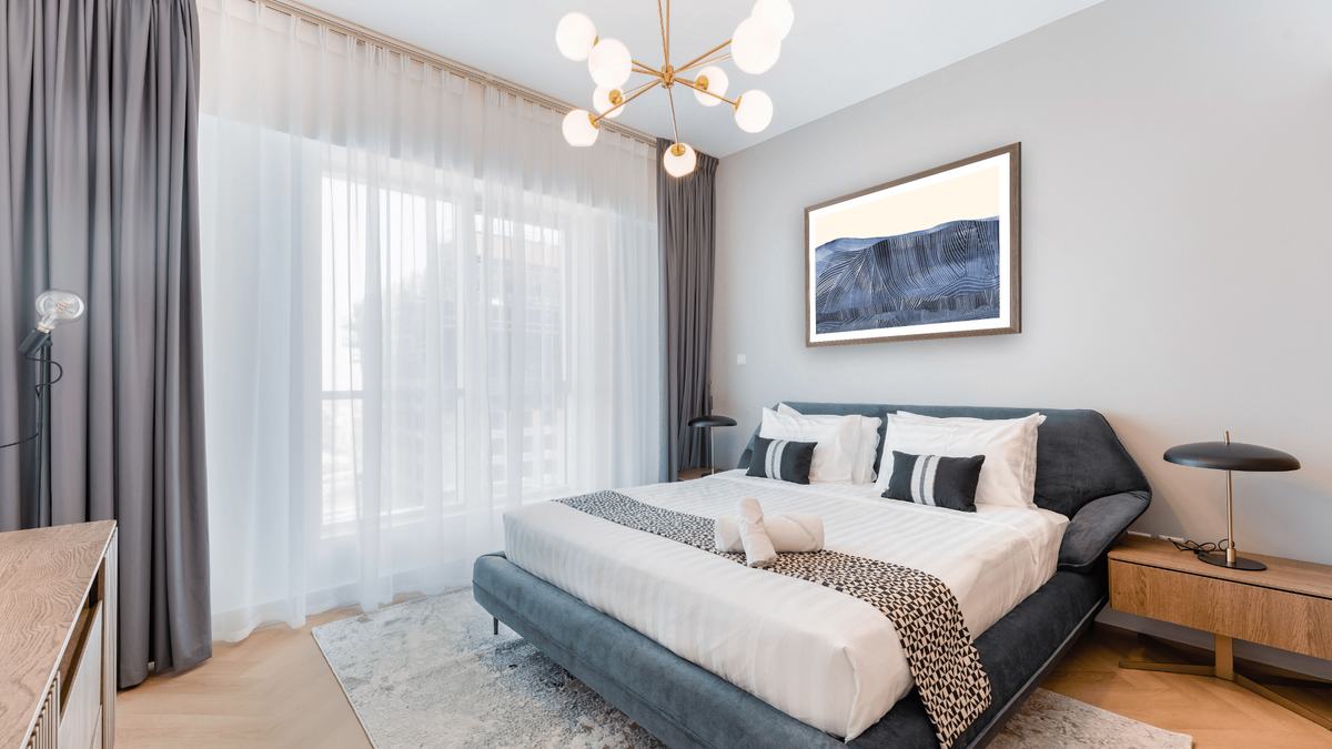 Crash by Dan Hobday, shown at 30 × 42 in (76.2 × 106.7 cm) in Arber Light Walnut, hotel guest room