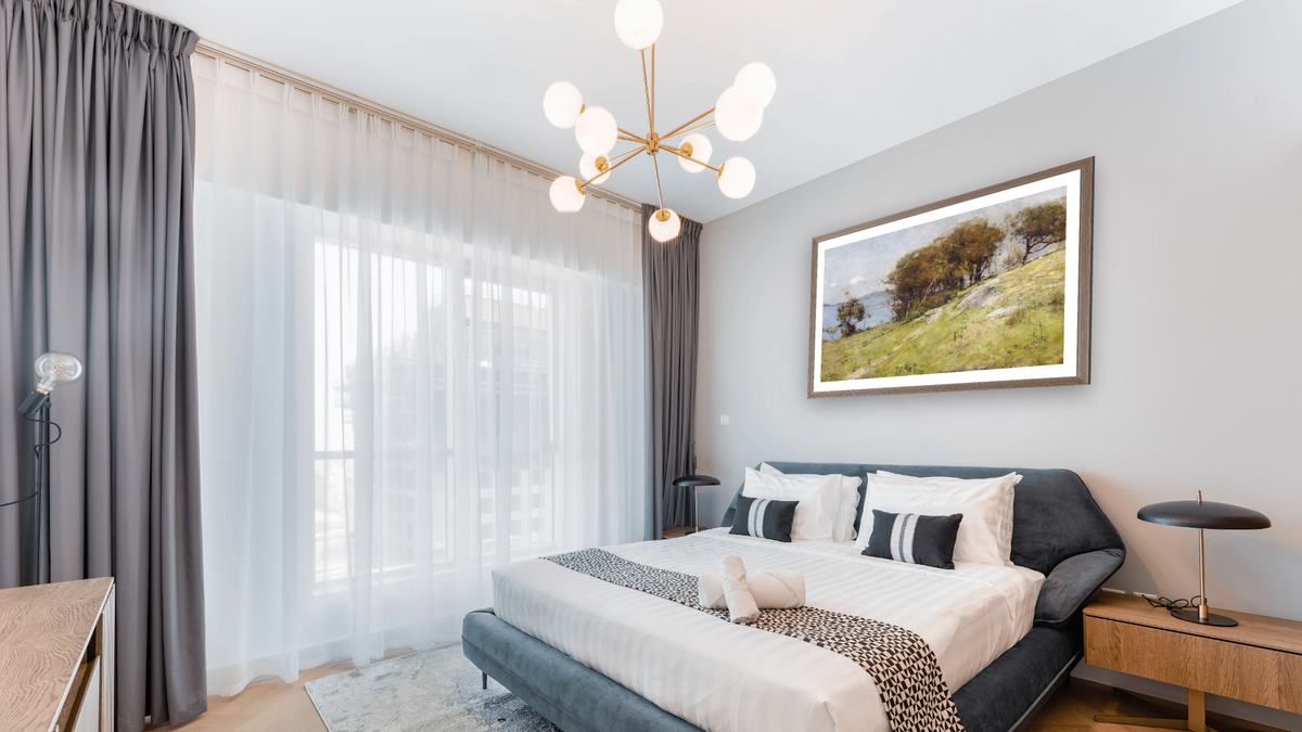 Cremorne pastoral by Arthur Streeton, shown at 28 × 42 in (71.1 × 106.7 cm) in Arber Light Walnut, hotel guest room