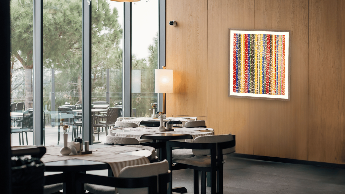 Breeze Rustling Through Fall Flowers by Alma Thomas, shown at 35 × 40 in (88.9 × 101.6 cm) in Arber Light Walnut, restaurant