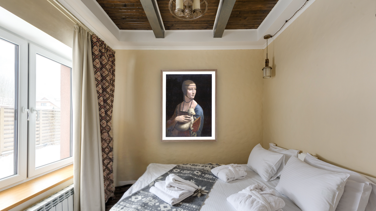 Portrait of Cecilia Gallerani (Lady with the Ermine) by Leonardo da Vinci, shown at 30 × 40 in (76.2 × 101.6 cm) in Arber Light Walnut, hotel guest room