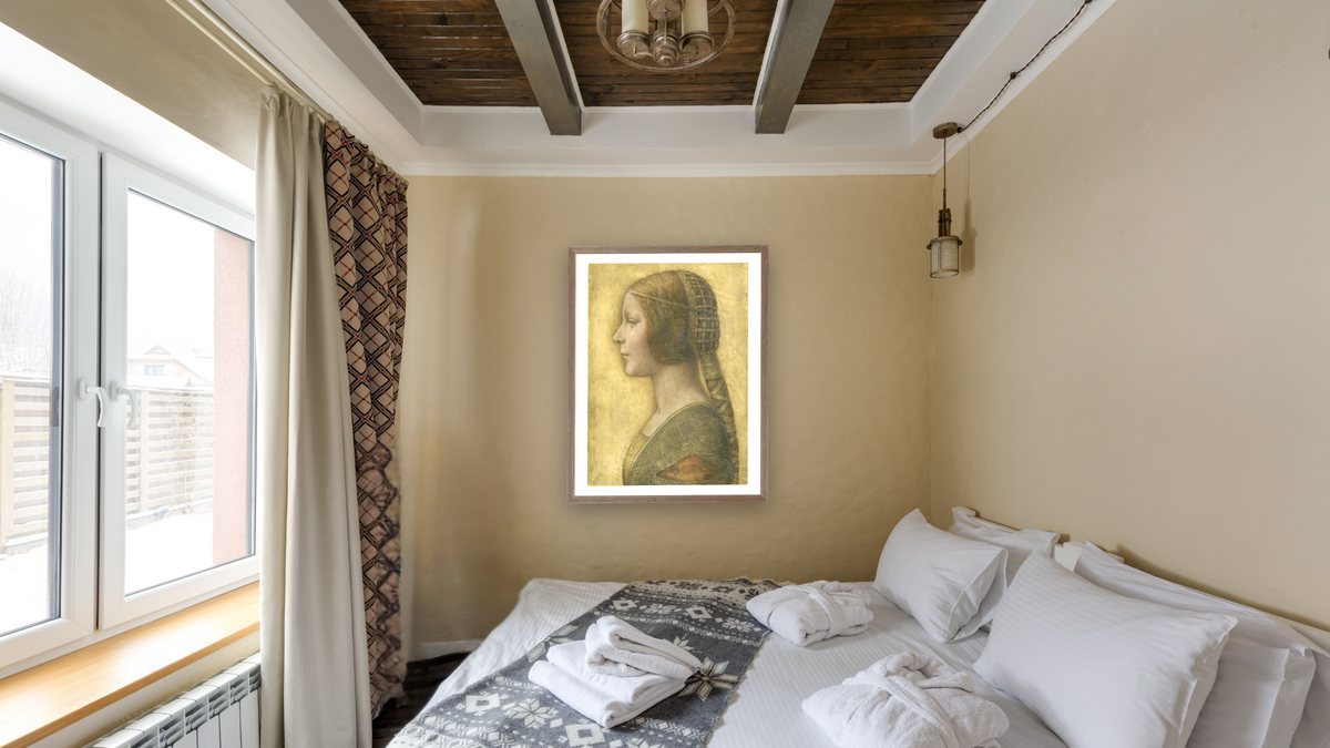 La Bella Principessa by Leonardo da Vinci, shown at 30 × 40 in (76.2 × 101.6 cm) in Arber Light Walnut, hotel guest room