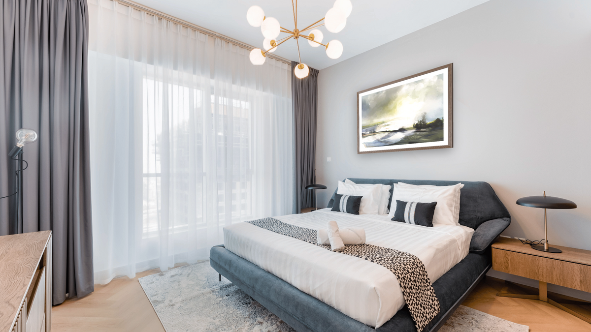 Highlands by Dan Hobday, shown at 30 × 42 in (76.2 × 106.7 cm) in Arber Light Walnut, hotel guest room