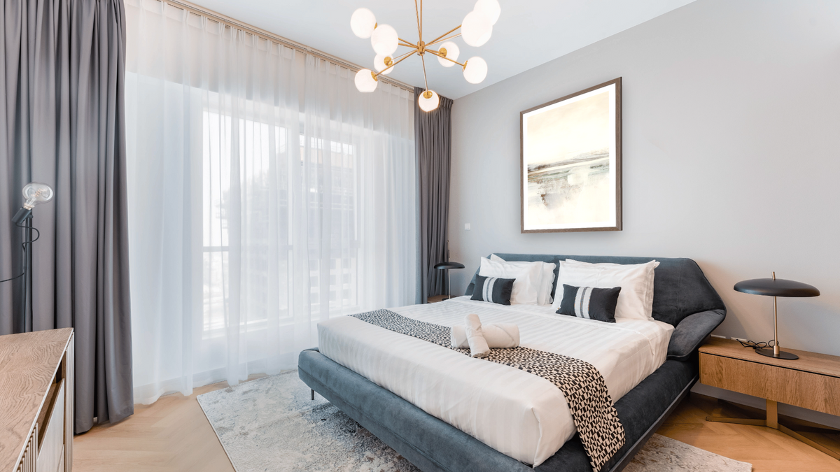 Calm Set 2 by Dan Hobday, shown at 30 × 42 in (76.2 × 106.7 cm) in Arber Light Walnut, hotel guest room