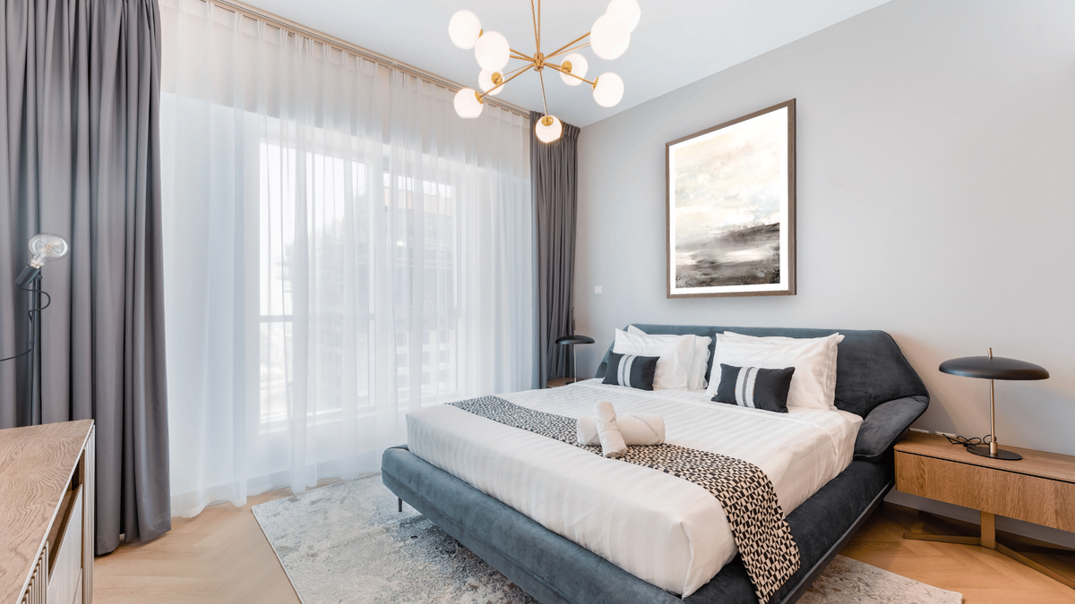Down Tempo 2 by Dan Hobday, shown at 30 × 42 in (76.2 × 106.7 cm) in Arber Light Walnut, hotel guest room