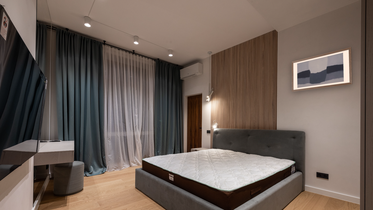 Japanese Landscape by Felrath Hines, shown at 20 × 40 in (50.8 × 101.6 cm) in Arber Light Walnut, hotel guest room