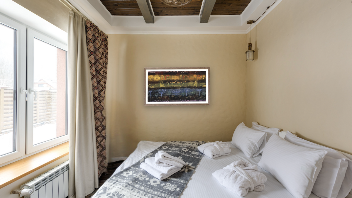 Garden on the Level by Paul Klee, shown at 21 × 40 in (53.3 × 101.6 cm) in Arber Light Walnut, hotel guest room