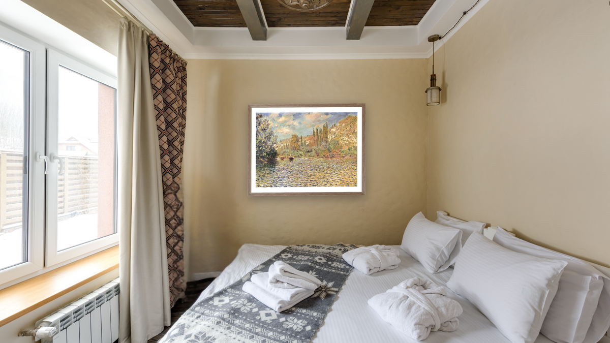 The Seine at Vetheuil by Claude Monet, shown at 30 × 40 in (76.2 × 101.6 cm) in Arber Light Walnut, hotel guest room