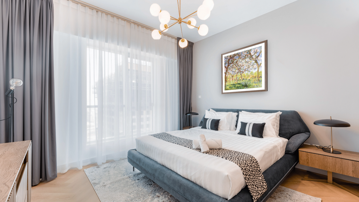 Spring at Giverny by Claude Monet, shown at 31 × 32 in (78.7 × 81.3 cm) in Arber Light Walnut, hotel guest room