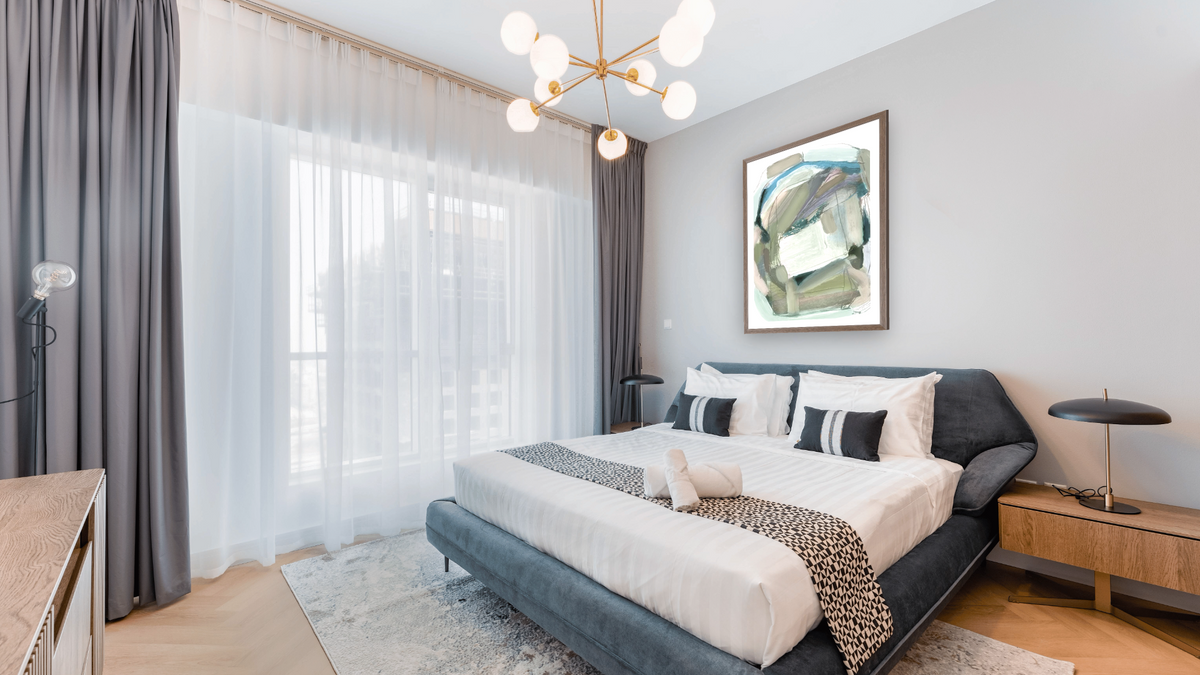 Lush Canvas by Dan Hobday, shown at 30 × 42 in (76.2 × 106.7 cm) in Arber Light Walnut, hotel guest room