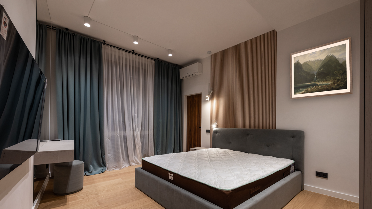 In Milford Sound, West Coast, New Zealand, shown at 32 × 40 in (81.3 × 101.6 cm) in Arber Light Walnut, hotel guest room
