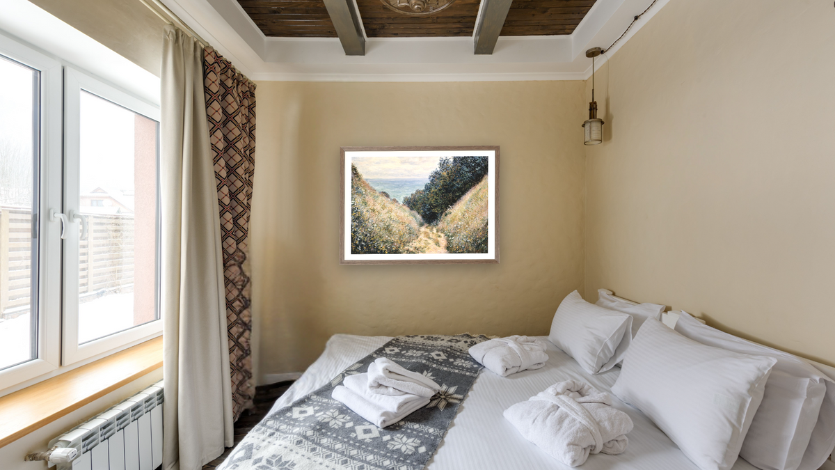 Road at La Cavée, Pourville by Claude Monet, shown at 28 × 40 in (71.1 × 101.6 cm) in Arber Light Walnut, hotel guest room