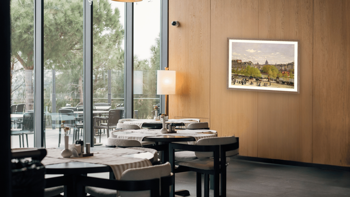 Quai du Louvre, Paris, by Claude Monet, shown at 29 × 42 in (73.7 × 106.7 cm) in Arber Light Walnut, restaurant