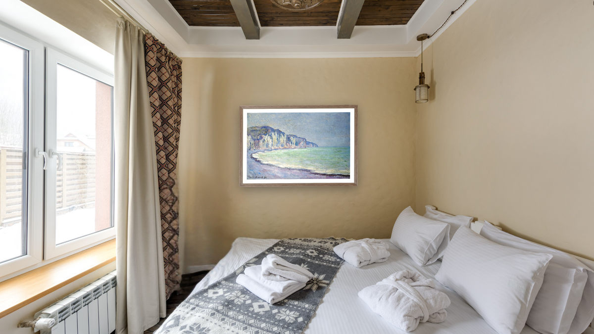 Cliffs at Pourville by Claude Monet, shown at 27 × 42 in (68.6 × 106.7 cm) in Arber Light Walnut, hotel guest room