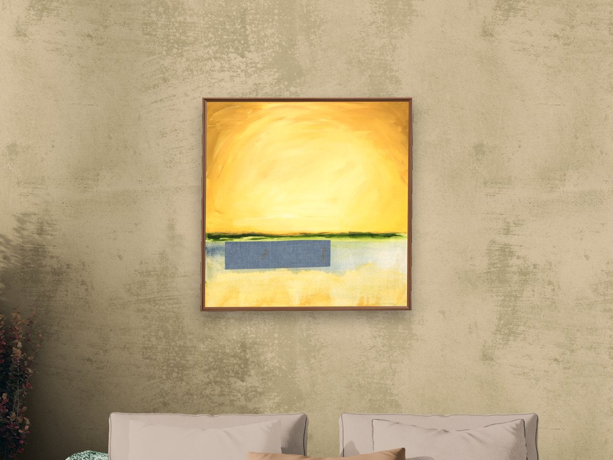 A framed canvas print of a contemporary painting on a living room wall